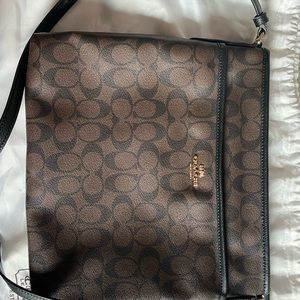 Coach brown monogram crossbody bag with tag and dust bag.